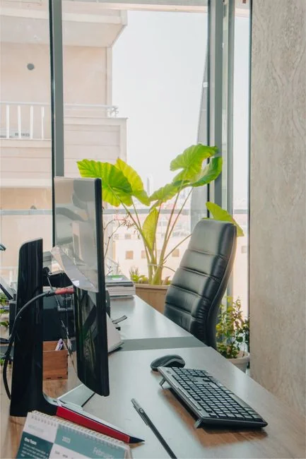 A focused designer works on a user-centric project in a modern office environment.